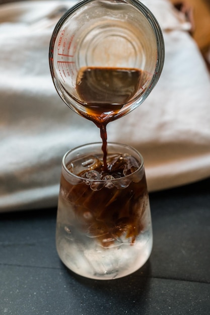 iced coffee served on the black table at a cafe