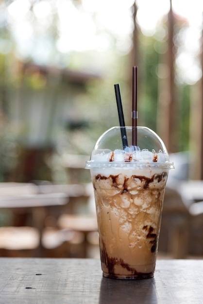 Iced coffee with caramel syrup and whipped cream