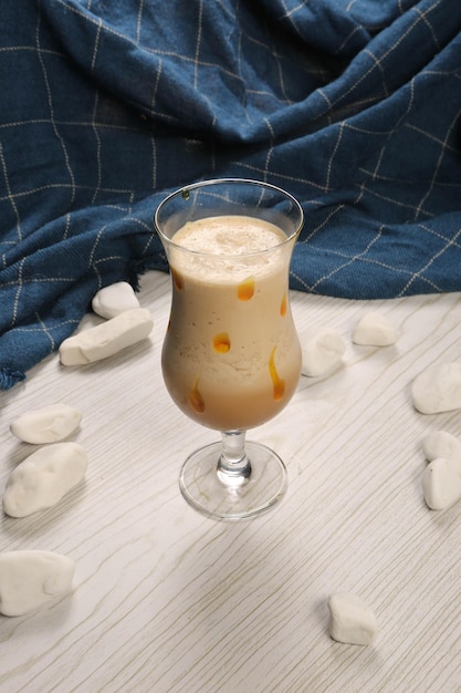 Iced coffee with milk Iced coffee latte Woman holding glass cup of iced coffee