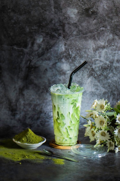 Iced green tea in a plastic glass with ice