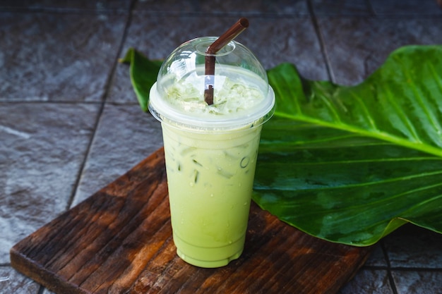 Iced green tea in takeaway cup