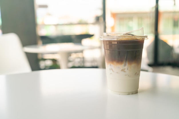 iced latte coffee cup on table in cafe coffee shop