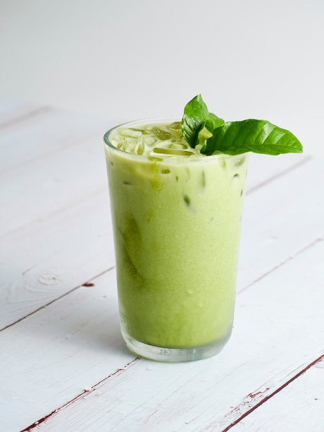 Iced Matcha Latte Tea with leaves.