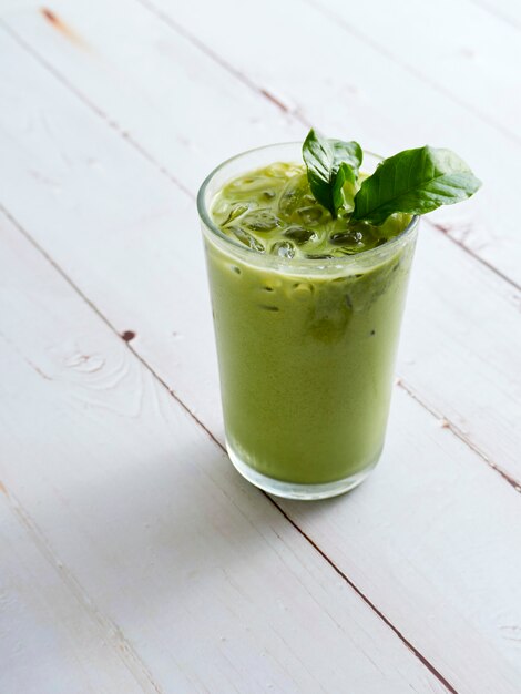 Iced Matcha Latte Tea with leaves.