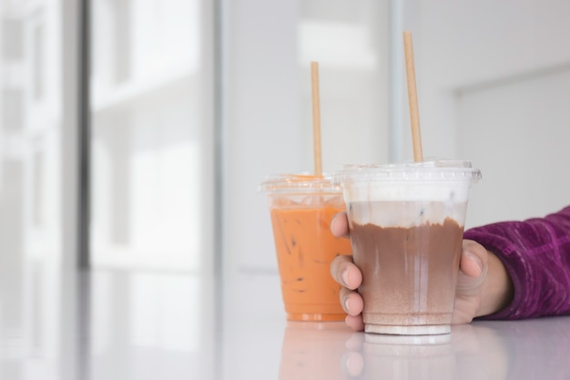 Photo iced milk drinks in white coffee shop, stock photo