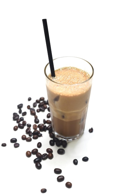 Iced milk espresso with coffee beans on white background closeup