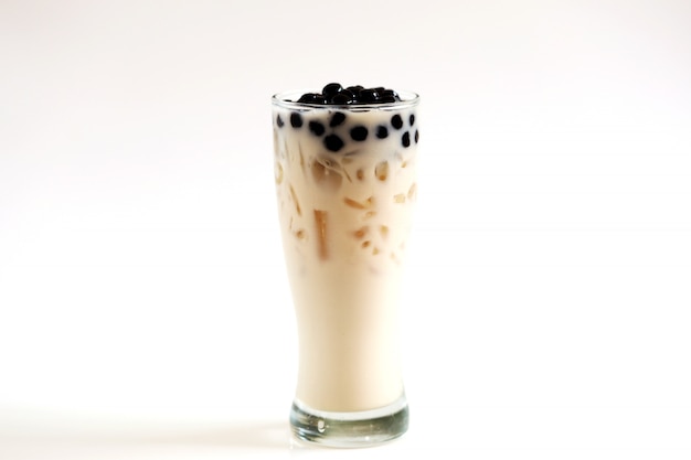 Iced milk tea and bubble boba in the glass on the wood, Isolate ice milk on white background with clipping path