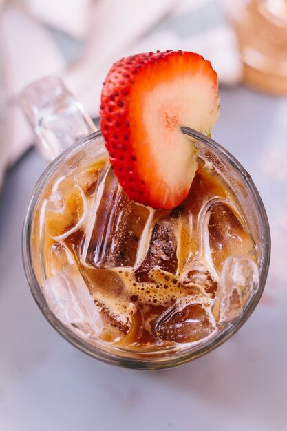 Iced Strawberry Milk pouring with espresso.