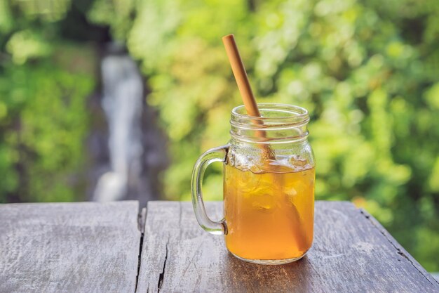 Iced tea on the background of waterfalls