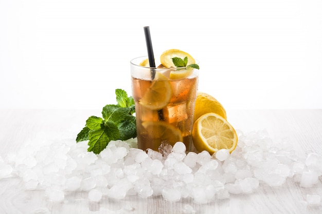 Iced tea drink with lemon in glass