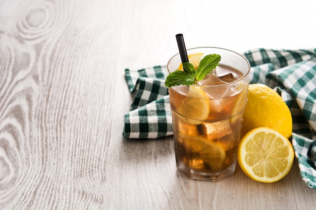 Iced tea drink with lemon in glass