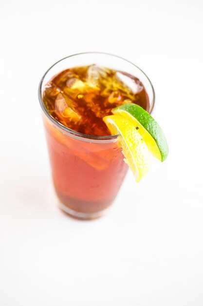 Iced tea garnished with lemon and lime.