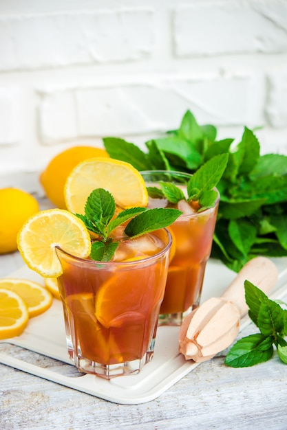 Iced tea, lemon and mint. Selective focus.