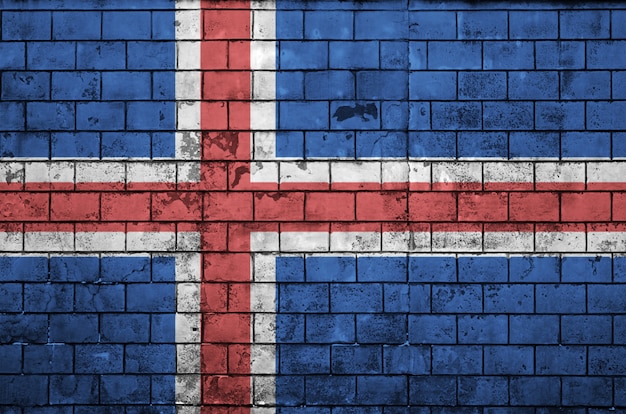 Iceland flag is painted onto an old brick wall