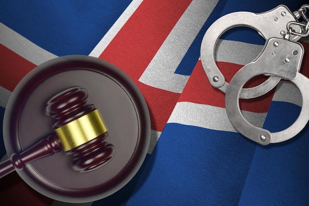 Iceland flag with judge mallet and handcuffs in dark room Concept of criminal and punishment background for judgement topics
