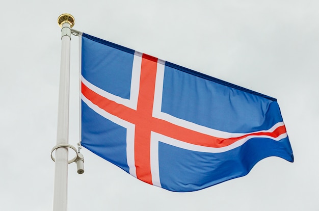 Icelandic flag waving in the wind against sky