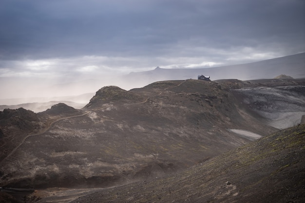 Icelandic Hut on the volcanic landscape with spectacular view on the Fimmvorduhals hiking trail. Iceland.