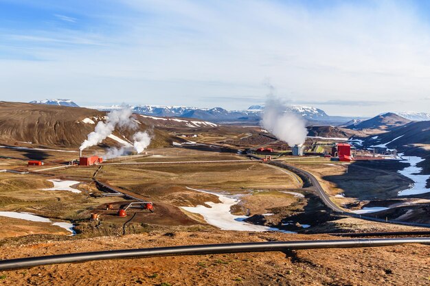 Icelandic landscape with geothermal power plant station and pipes in the valley myvatn lake surroundings iceland