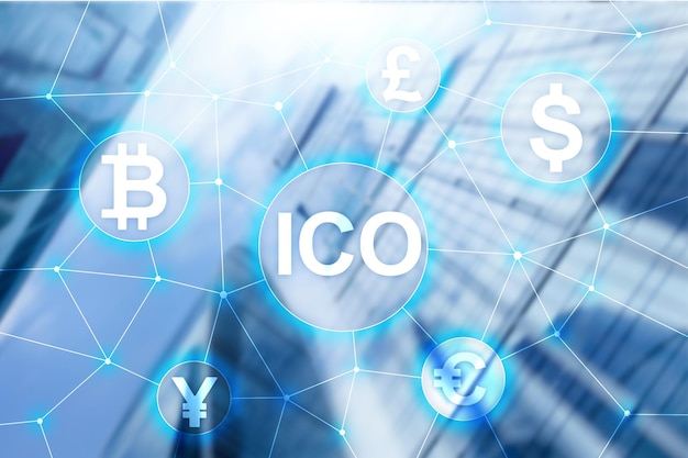 ICO Initial coin offering Blockchain and cryptocurrency concept on blurred business building background