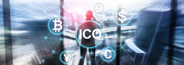 ICO Initial coin offering Blockchain and cryptocurrency concept on blurred business building background