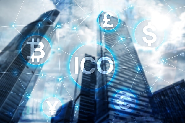 ICO Initial coin offering Blockchain and cryptocurrency concept on blurred business building background