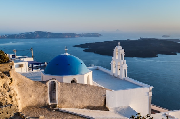 Iconic church with blue dome in Oia Santorini island Greece