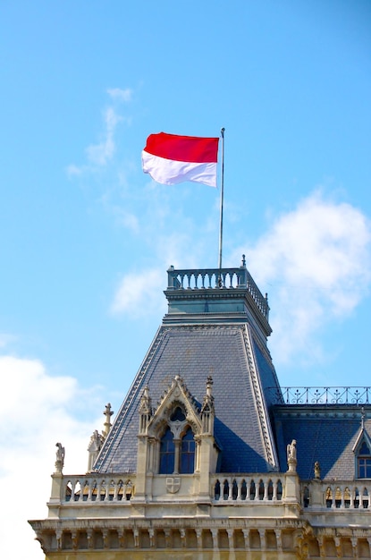 Iconic image of a poland flag on a traditional roof