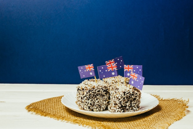 Iconic traditional Australian party food Lamington cakes on a red white and blue background