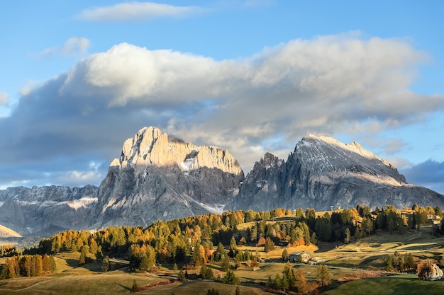 Iconic view of Seiser Alm Alpe di Siusi with Sassolungo and Sassopiatto mountains South Tyrol Italy