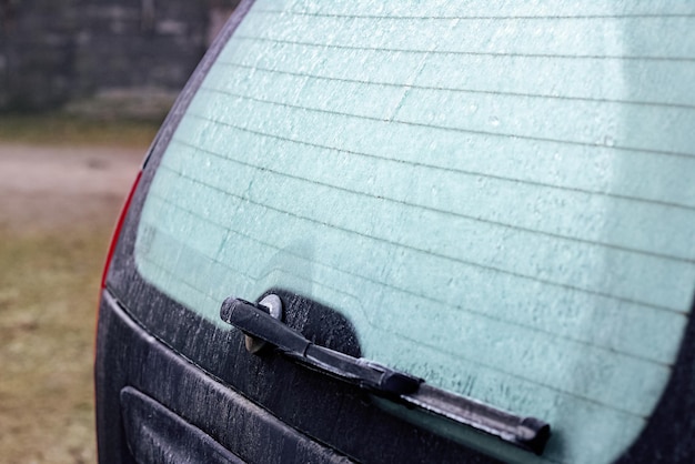 icy rear window of a black car