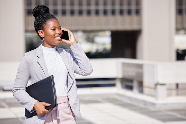 Id love to meet to discuss this. Shot of a young businesswoman making a phone call using her smartphone.