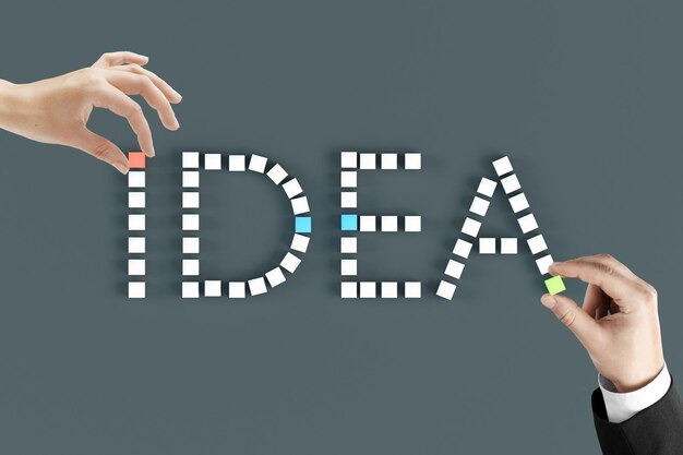 Idea concept hands arranging word