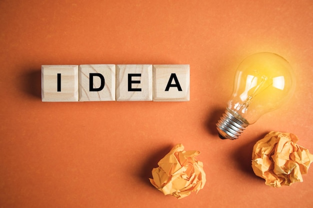 idea concept idea text on wooden cubes with light bulb