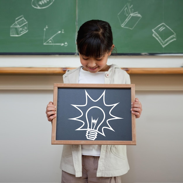 Idea and innovation graphic against cute pupil showing chalkboard