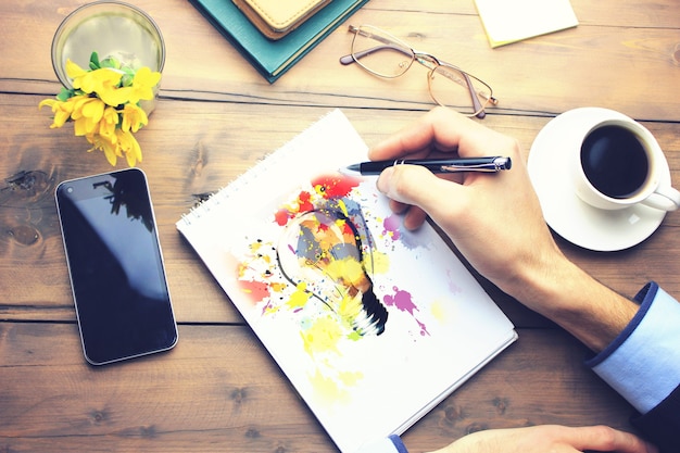 Photo idea on paper on working wooden table