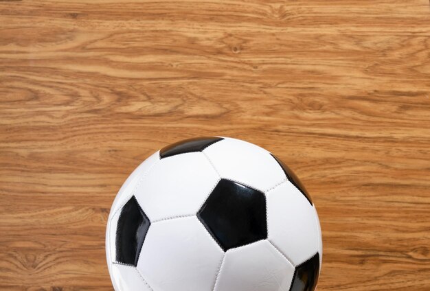 Idea of soccer training and healthy lifestyle Soccer ball on a wooden background