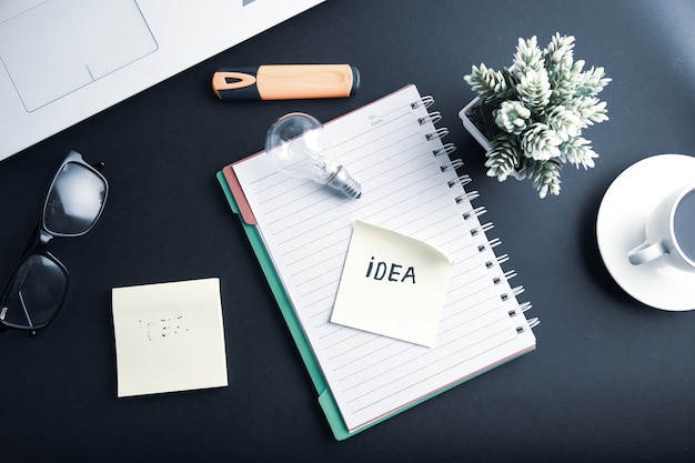 Idea text with bulb and keyboard on desk