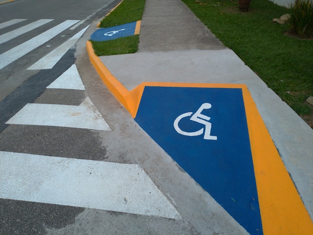 Identification wheelchair access ramp and crosswalk.