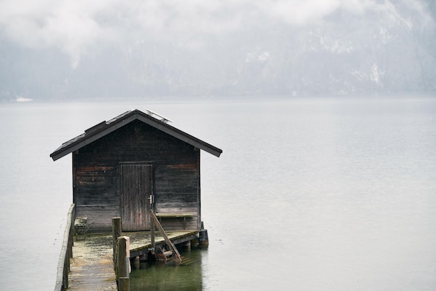 Idyllic Alpine Retreat A Charming Wooden House Nestled by a Lake in the Austrian Alps Offering Breathtaking Mountain Views and a Perfect Blend of Natural Beauty and Traditional Architecture