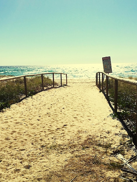 Idyllic view of beach against sky