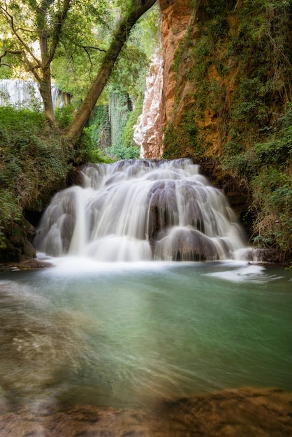 Idyllic Waterfall in rainforest landscape.