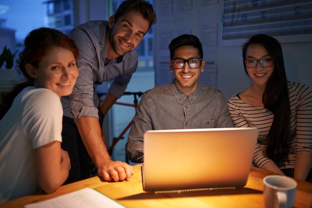 If you can dream it we can design it Shot of coworkers working into the evening in the office