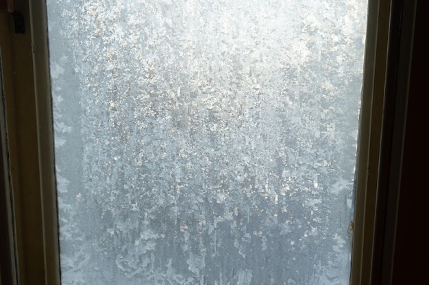 Foto ijzig raam. ijs textuur winter achtergrond
