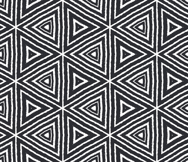 Ikat repeating swimwear design. Black symmetrical kaleidoscope background. Textile ready comely print, swimwear fabric, wallpaper, wrapping. Summer ikat sweamwear pattern.