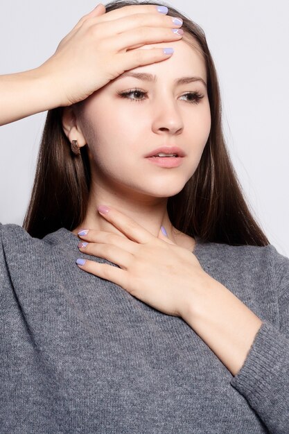 Illness, Health Care, people, Medicine concept - Throat Pain. Closeup Of Sick Woman With Sore Throat Feeling Bad, Suffering From Painful Swallowing. Beautiful Girl Touching Neck With Hand