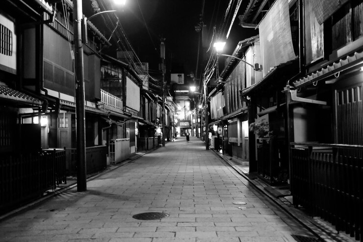 Photo illuminated alley amidst buildings in town