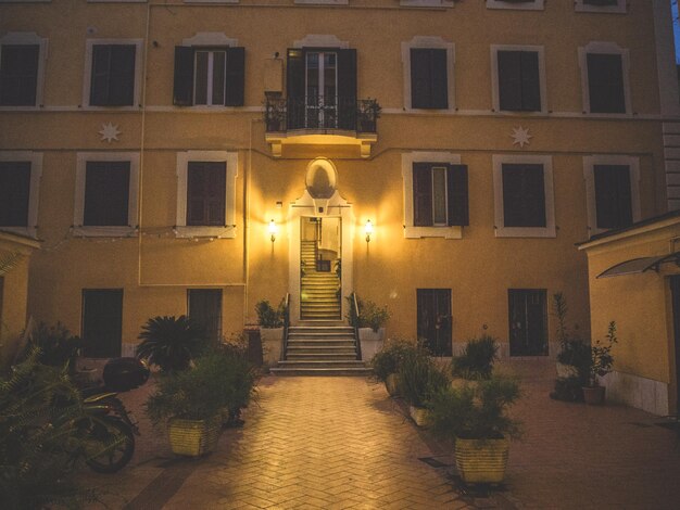 Illuminated building against sky at night