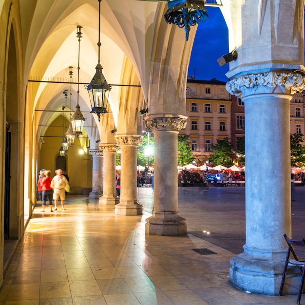 Illuminated building on old town square at night