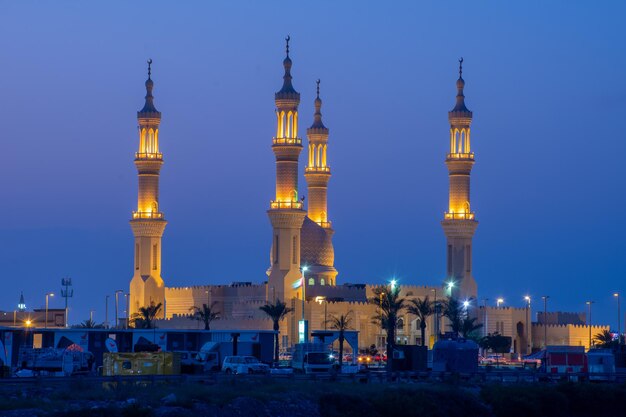 Illuminated buildings against sky at night