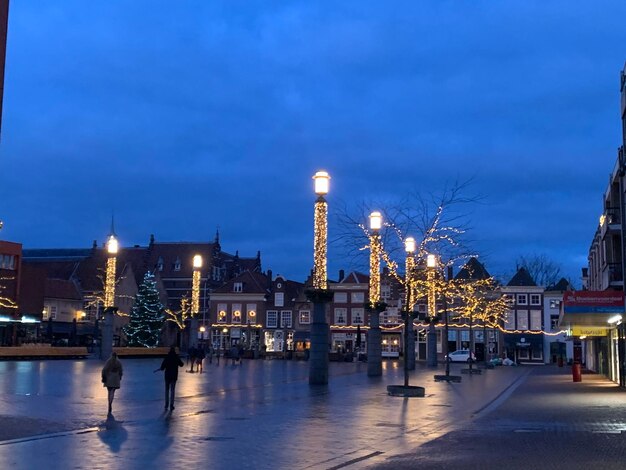 Illuminated buildings against sky at night